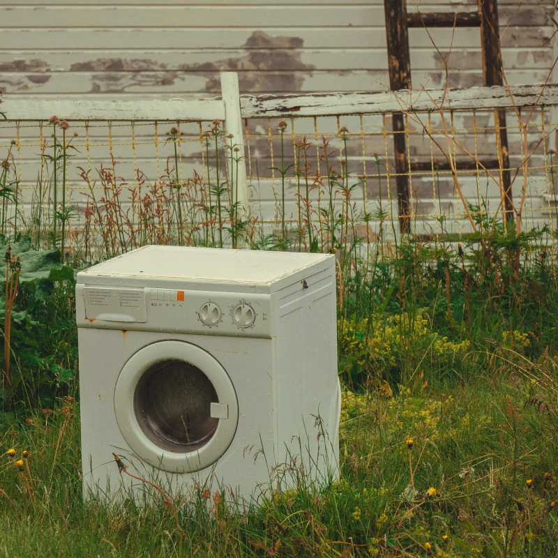 old washer junk in a yard